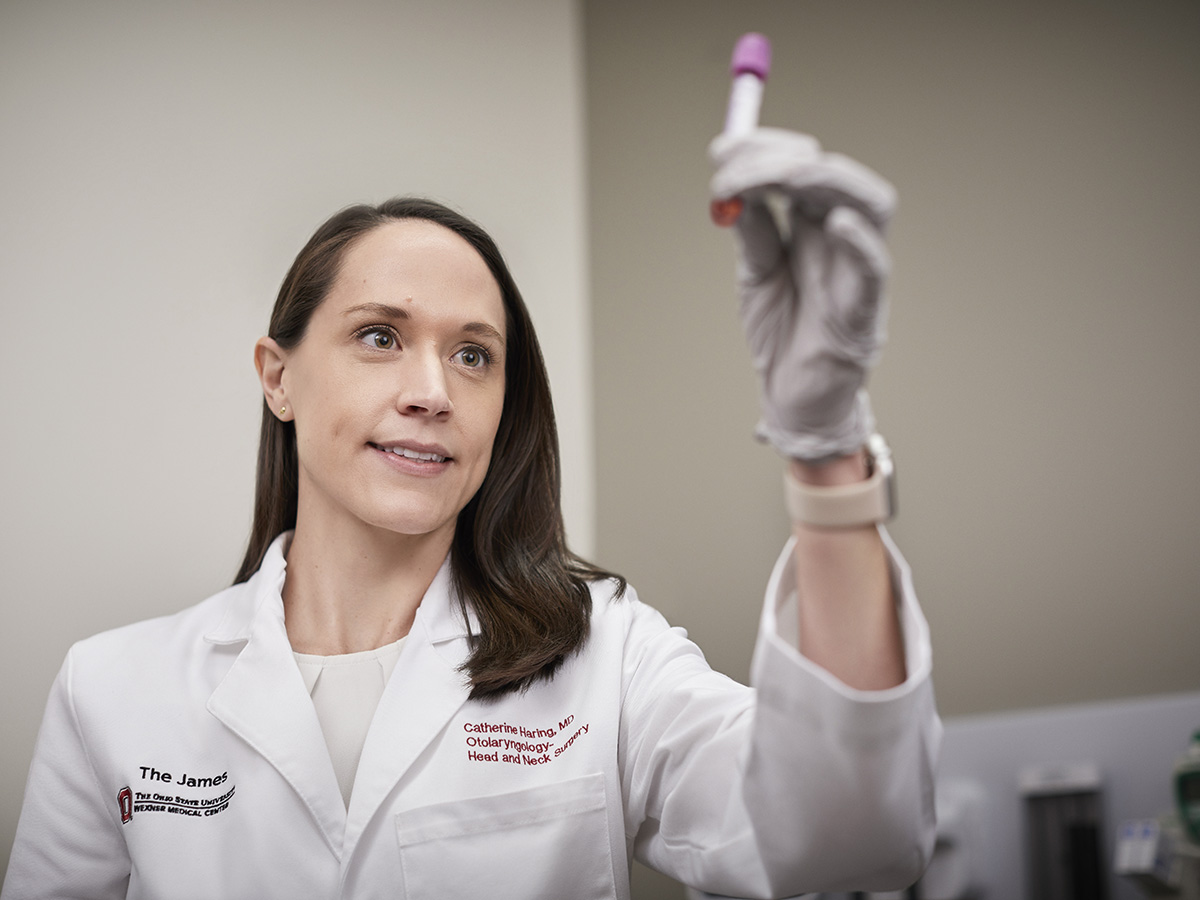 Dr Catherine Haring with a HPV biomarker test sample